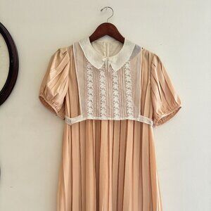 tba To Be Adored Nude Blush Pleated Dress with Silk Collared Bib